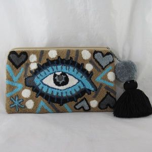 Clutch tapizada with Poms &Tassels